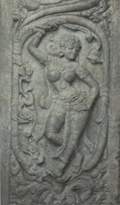 A carved panel of a dancing woman under a scroll of foliage, from the Panchesvara temple at Panagal.