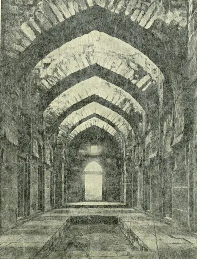 The interior of Shitab Khan's hall, a long passage under a row of pointed arches.