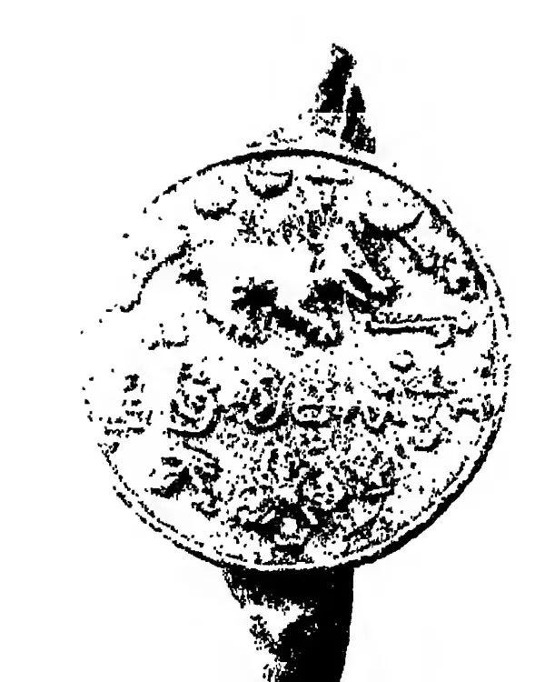 Photograph of a round seal on its ring, the face crowded with small emblems and a line of letters, washed pale in places by the scan.