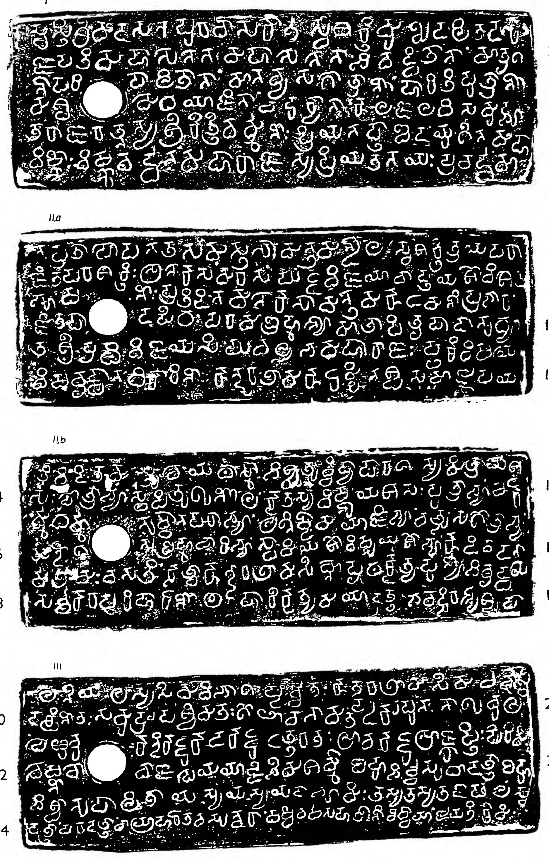 Ink impressions of four inscribed copper plates, the letters of the Telugu-Kannada script showing pale on a dark ground, each plate with a round ring hole near the left edge.