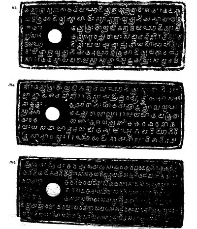 Ink impressions of three inscribed copper plates, the letters of the Telugu-Kannada script showing pale on a black ground, each plate with a round ring hole near the left edge.