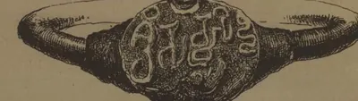 Drawing of an oval seal joined to a thick ring, seen from the side, its face filled with two lines of large letters.
