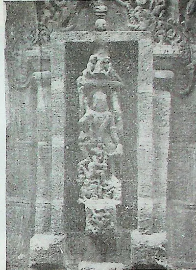A tall framed niche with a figure identified as Mahishamardini, the goddess slaying the buffalo demon, with smaller figures below.