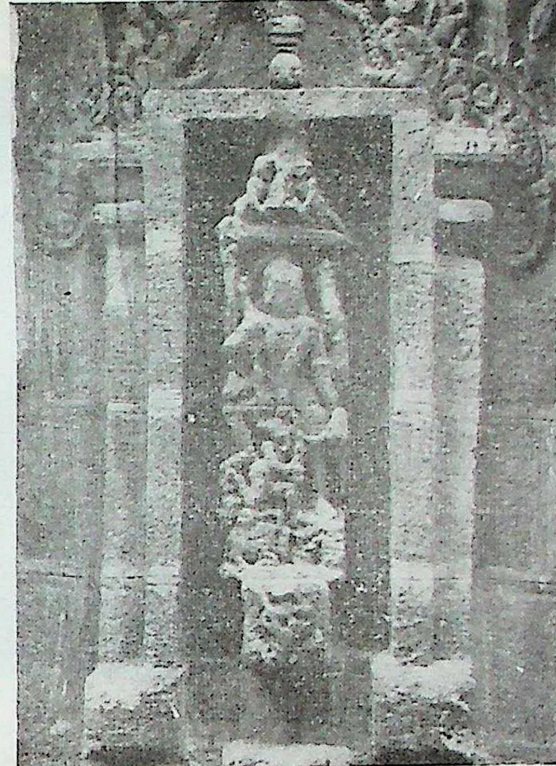 A tall framed niche with a figure identified as Mahishamardini, the goddess slaying the buffalo demon, with smaller figures below.