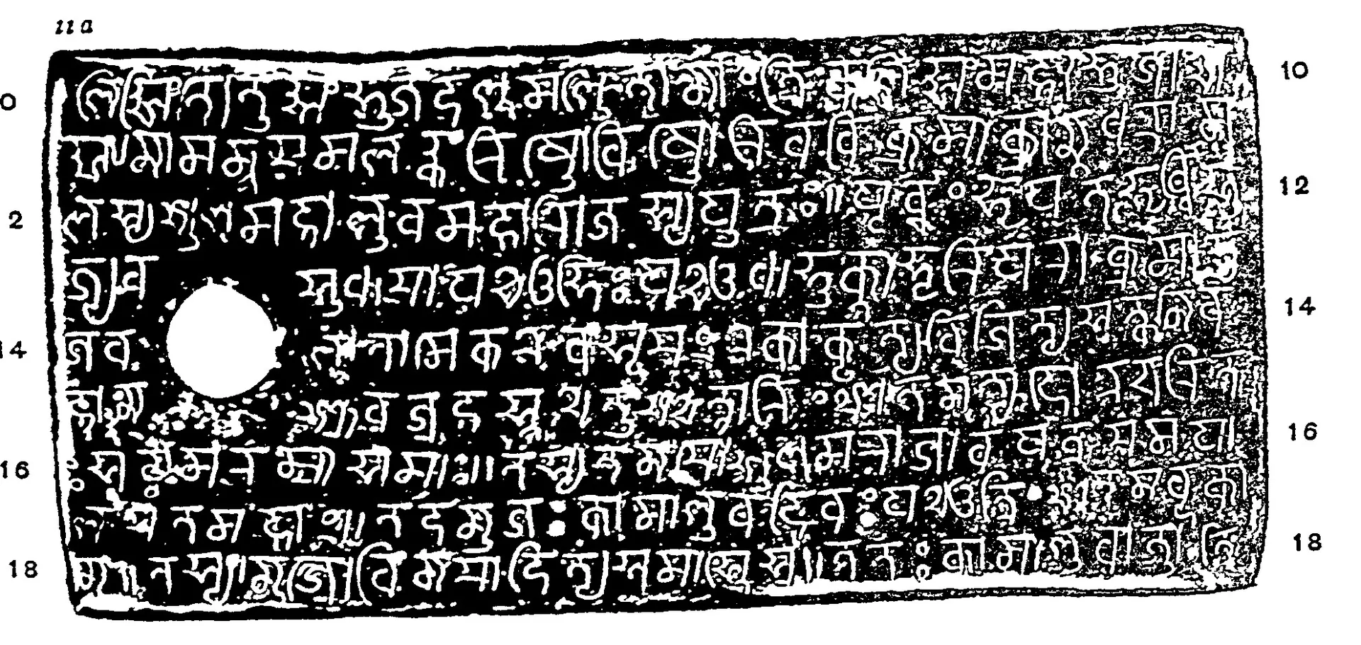 Photo-lithograph of one copper-plate face: nine lines of Nagari-influenced Kalinga letters in white on a black ground, a white ring-hole at the left, line numbers in both margins.