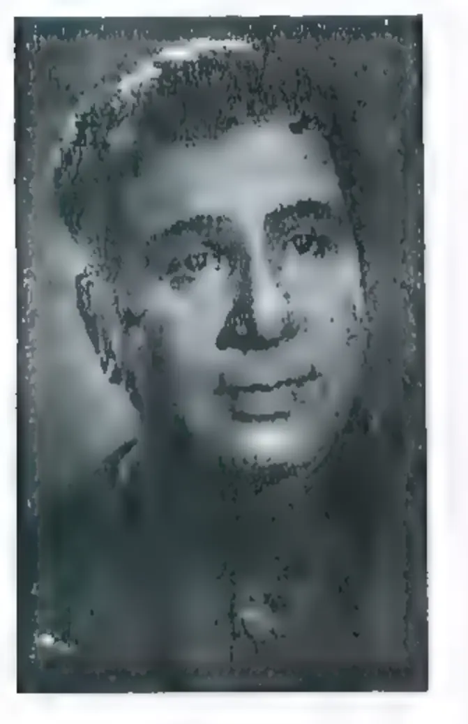Black-and-white head-and-shoulders portrait of a man with wavy hair, looking at the camera.