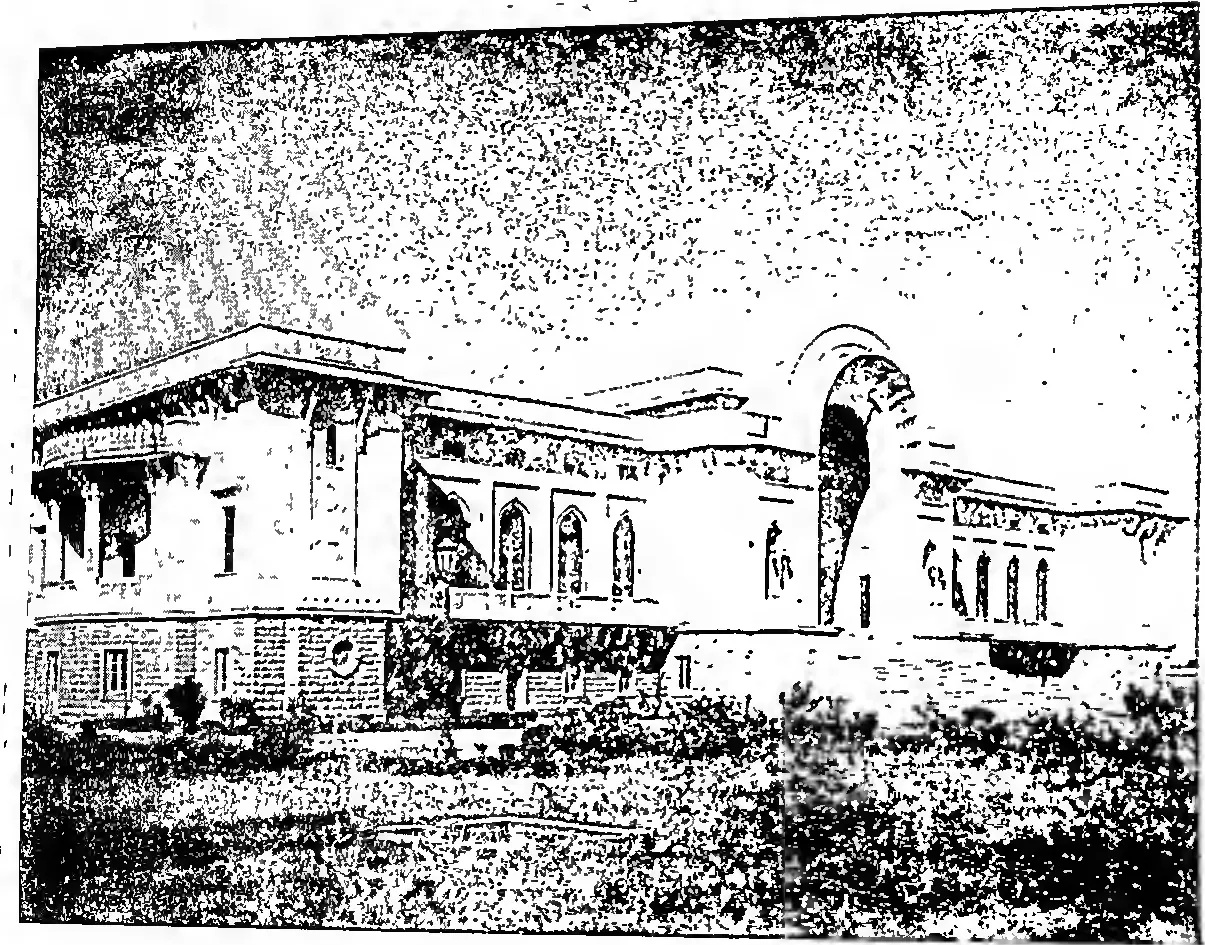 Grainy photograph of a long two-storeyed building with arched windows, a tall arched entrance bay and a garden in front.