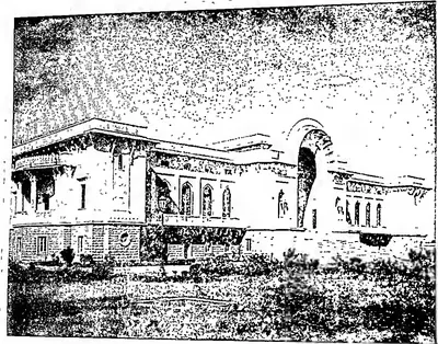 Grainy photograph of a long two-storeyed building with arched windows, a tall arched entrance bay and a garden in front.