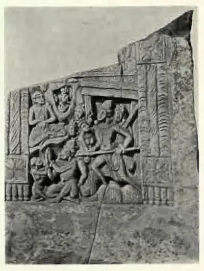 Broken carved slab with a crowded scene of figures in a framed doorway.