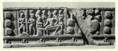 Long carved beam panel with figures in a palace scene between rows of lotus roundels.