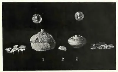 Photograph on a black ground of small relic objects at actual size: a corroded lump of silver numbered 1, a tiny bone fragment numbered 2, a round gold reliquary numbered 3, two small gold medallions above and scraps of gold flowers at the sides.