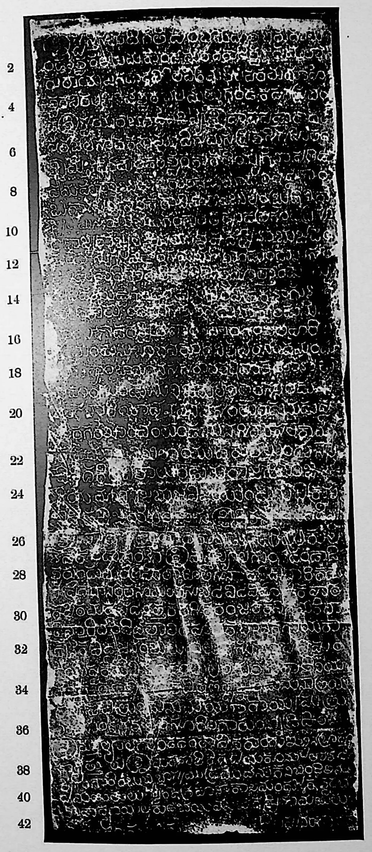 Ink impression of face I of the "Bothpur inscription of Malyāla Guṇḍa", white Telugu-Kannada letters on a black ground, with line numbers in the margin.
