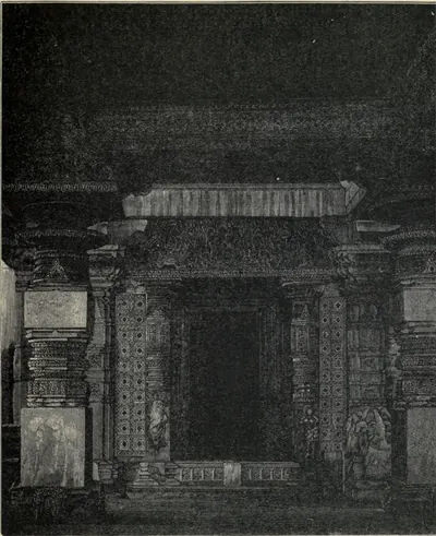 Wood engraving of a temple shrine doorway in deep shadow: a dark opening framed by jambs of pierced lattice screens and carved pillars, with a heavy carved lintel above.