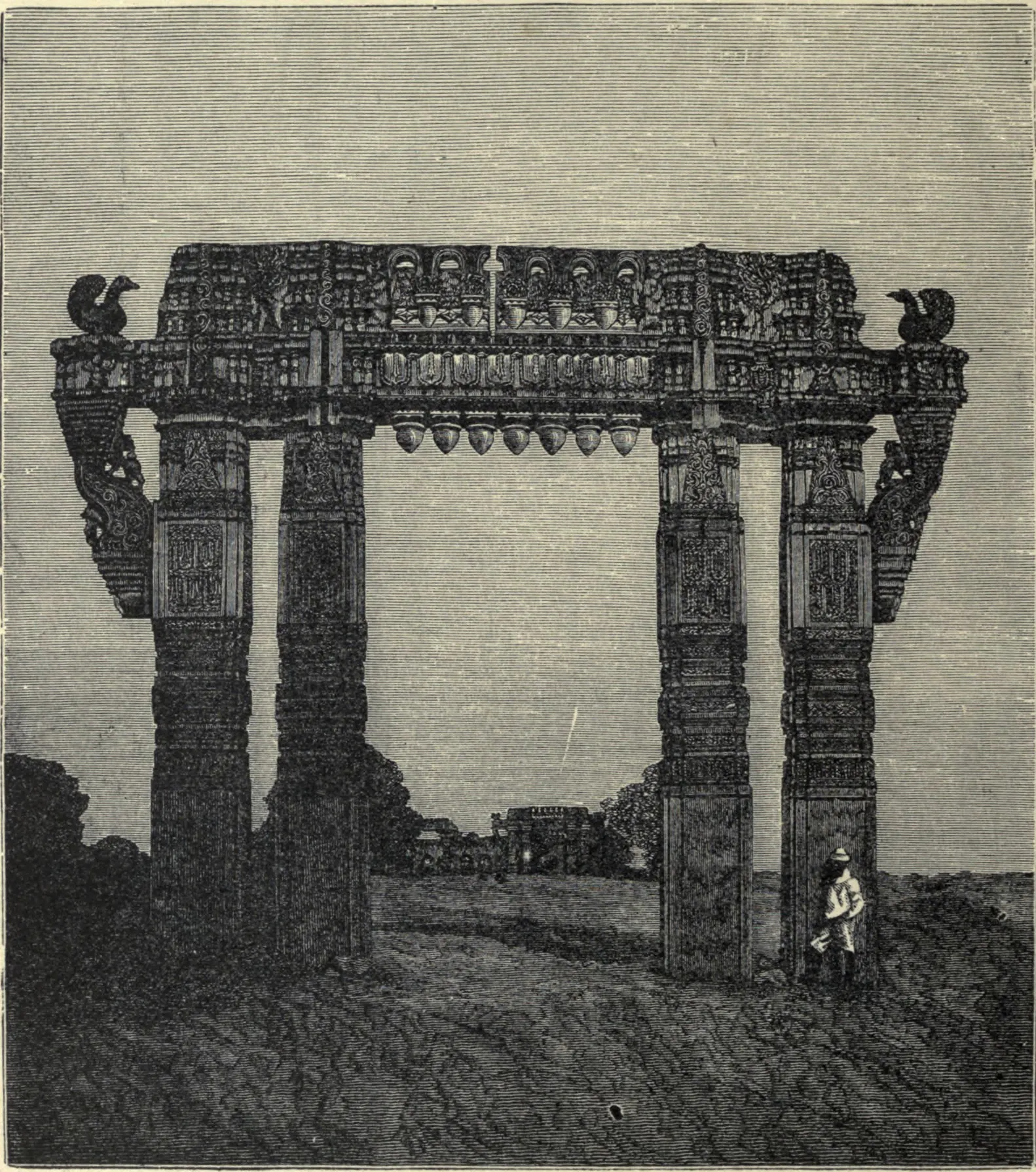 Wood engraving of a tall stone gateway of four carved pillars carrying a broad sculptured lintel with a goose at each end, standing in open ground; a man in a hat stands at its foot and ruins are seen in the distance.