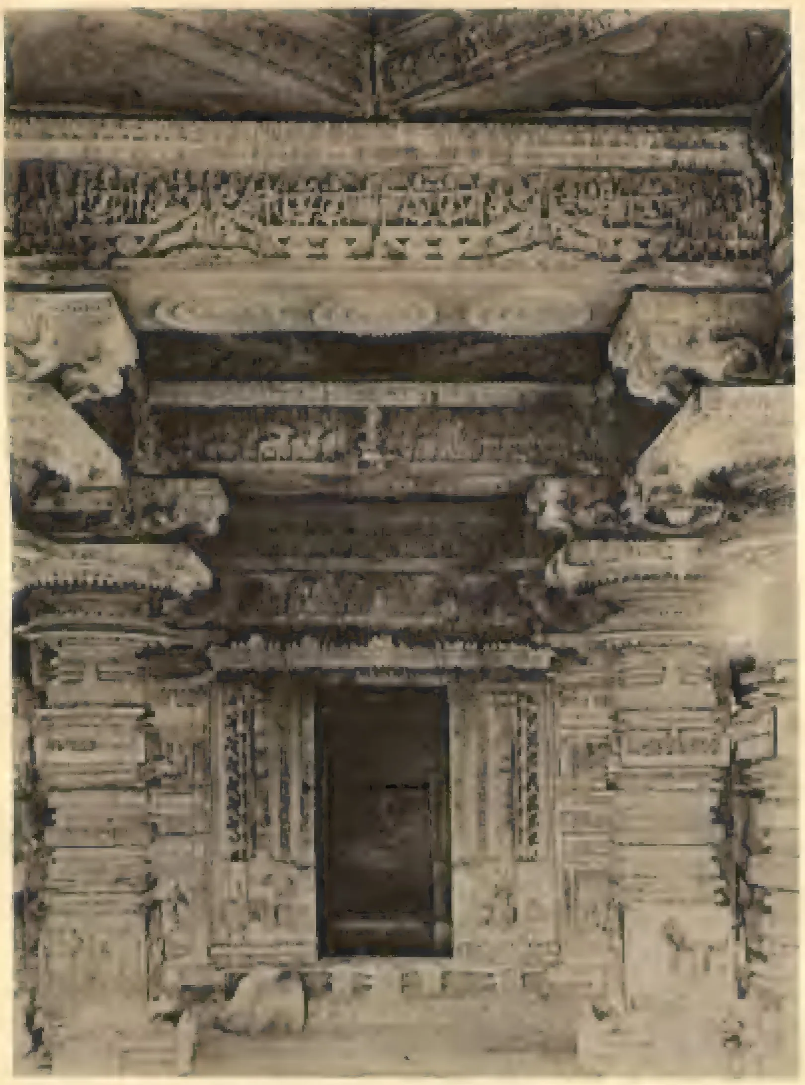 Interior of the southern temple at Nagulapadu: a carved shrine doorway between pillars, with richly carved beams, brackets and ceiling above.