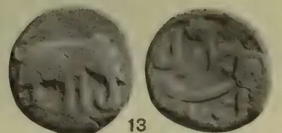 Photograph of the two sides of a worn copper coin, an elephant on one side and an inscription on the other, with the number 13.
