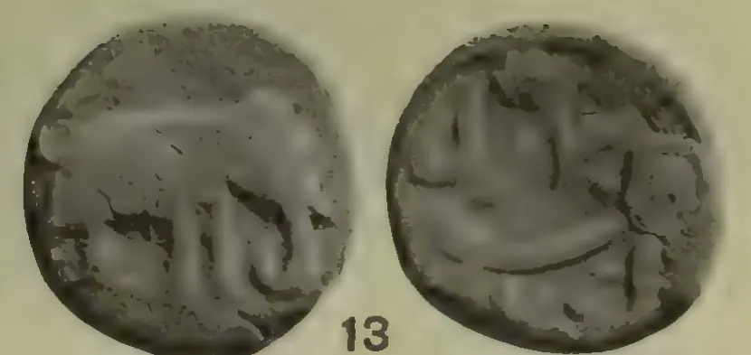 Photograph of the two sides of a worn copper coin, an elephant on one side and an inscription on the other, with the number 13.