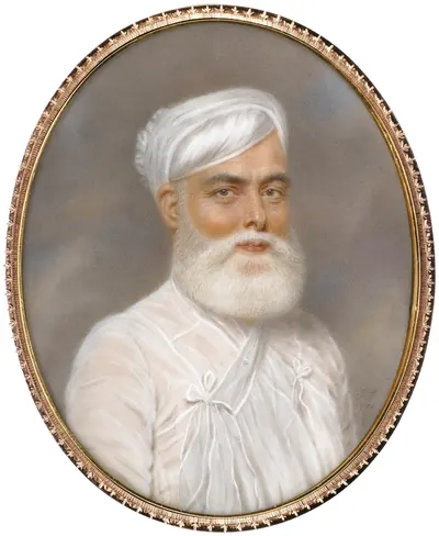 Oval portrait miniature in a gold frame of an elderly man with a full white beard, wearing a white turban and a white muslin robe tied at the chest.