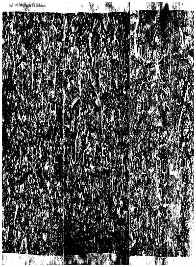 A dark, speckled ink impression of a rough rock surface filling the page, with a few large white letters in rows and a printed title along the top.