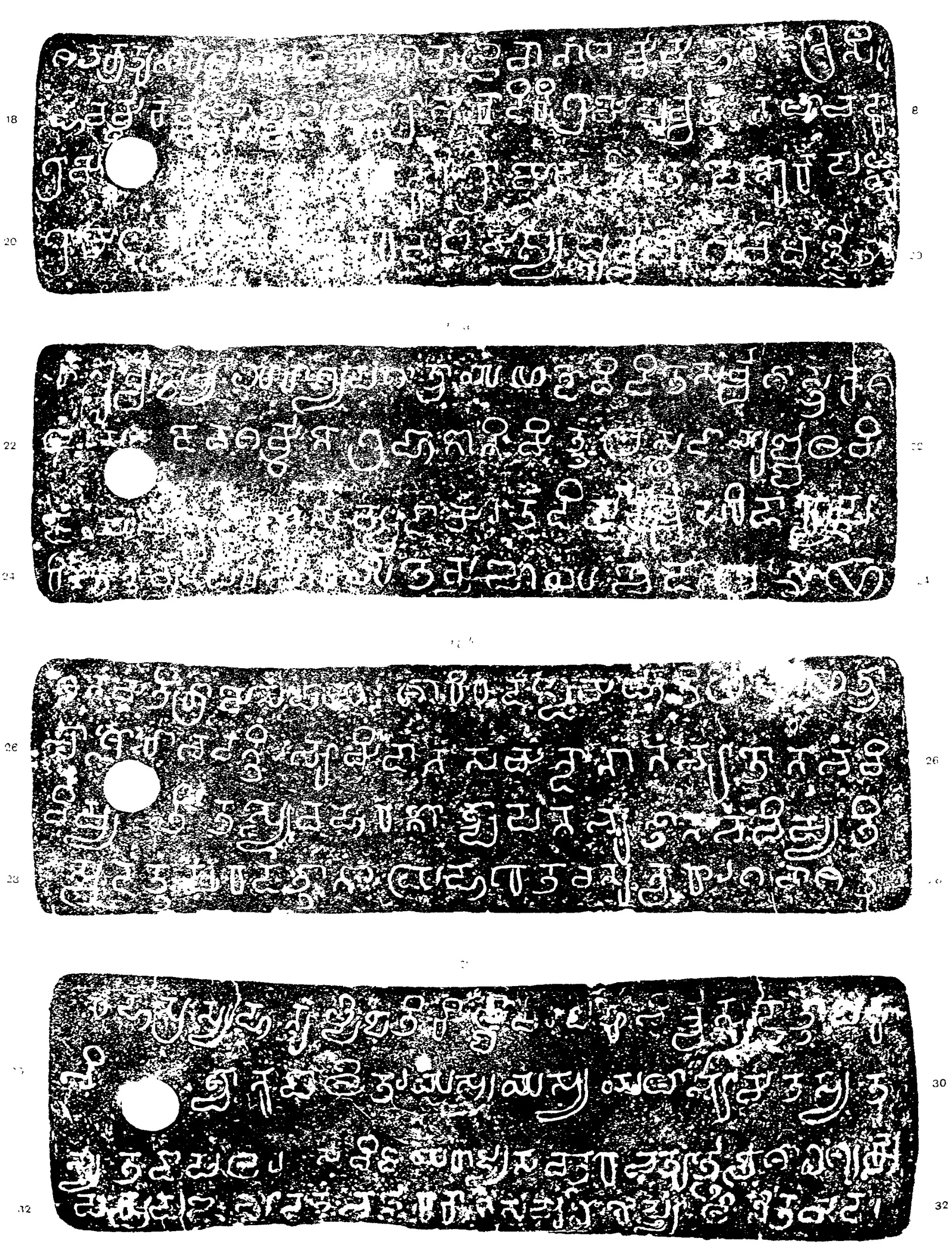 Ink impressions of four inscribed copper plates, white letters of southern (Pallava) script on black with speckled patches, four lines each, a ring hole at the left and line numbers 18 to 32.