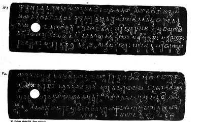 Two long copper-plate facsimiles, white letters on black, each with a round ring hole and four or five lines of southern (Pallava) script, labelled IV b and V a, with the imprint "W. Griggs photo-lith. from originals".