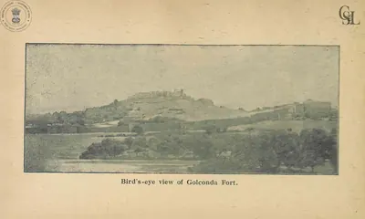 Photograph of the fortified hill of Golconda rising above trees and open ground.