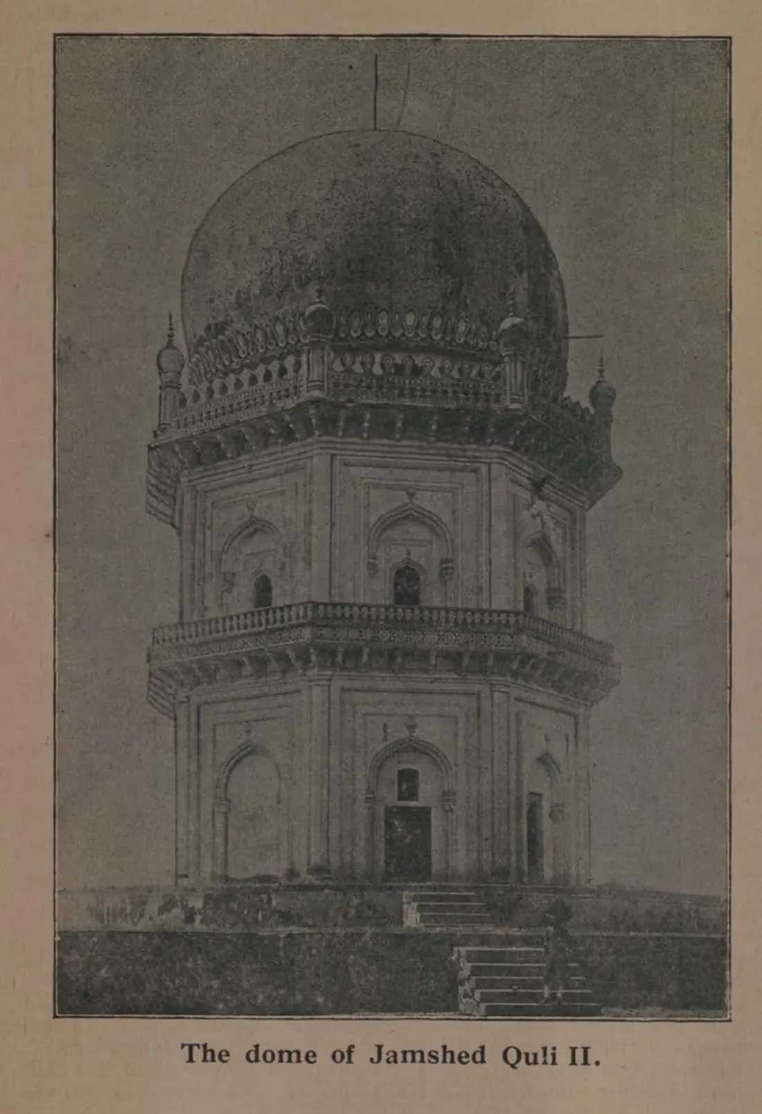 Photograph of the two-storeyed octagonal tomb of Jamshed Quli Qutb Shah with arched niches, a balcony and a dome.