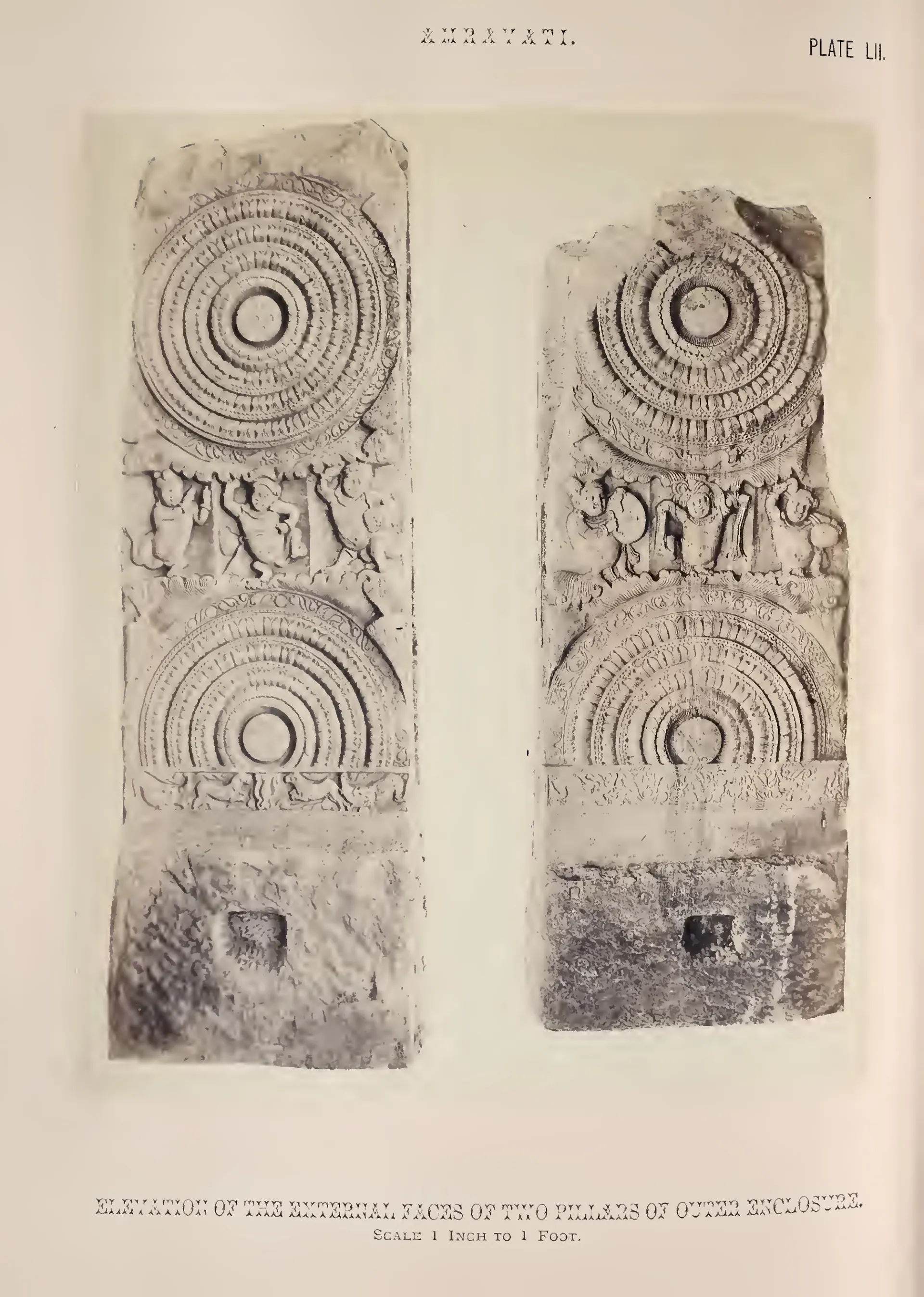 Photograph of two worn rail pillars carved with lotus medallions.