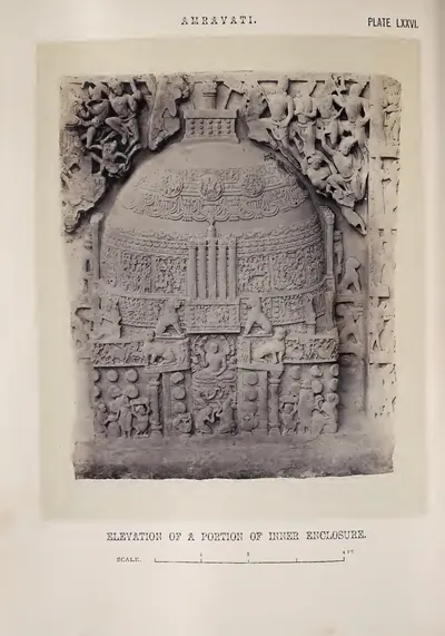 Photograph of a slab carved with a stupa, its dome, pillars and worshippers in high relief.