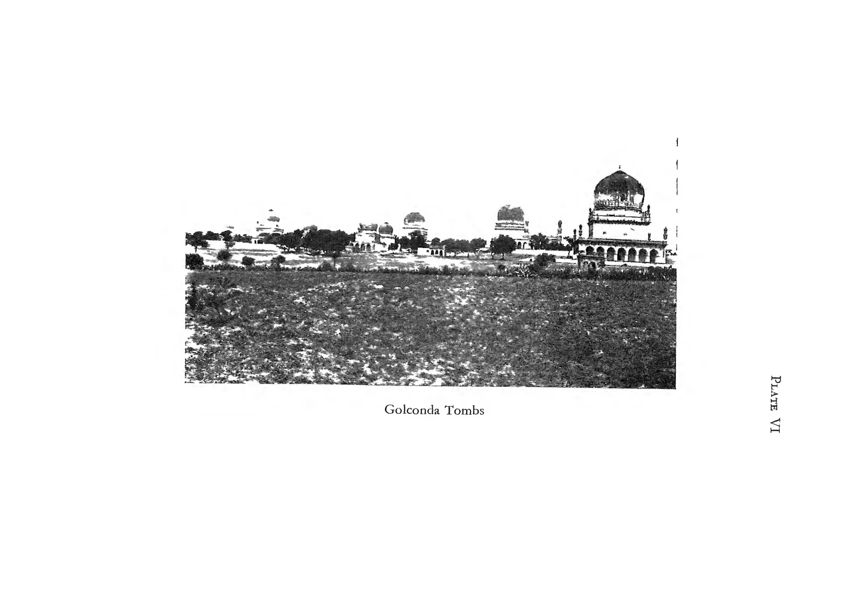 Photograph of the domed Qutb Shahi tombs seen across open ground.