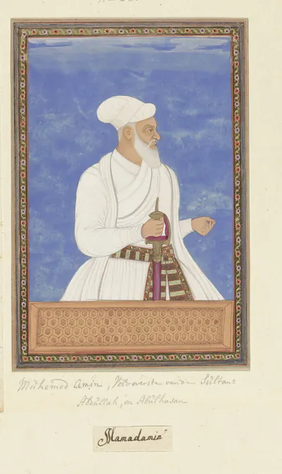 Deccani painting of an old white-bearded man in a white robe and white turban, a dagger at his sash, against a blue ground in a decorated border, with ink labels below.