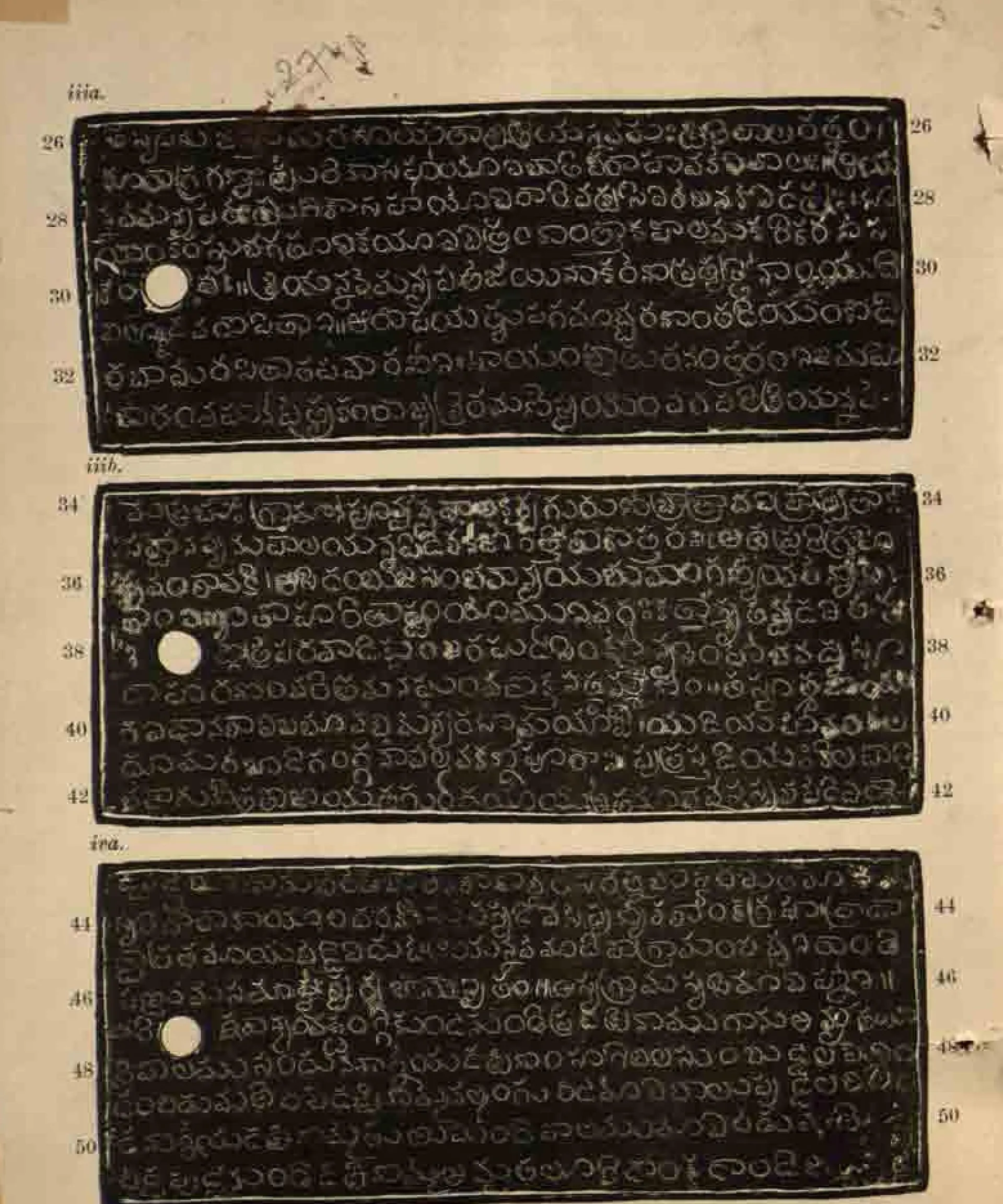 Ink impressions of three long copper-plate faces, white Telugu letters on black, each with a white ring hole at the left and line numbers 26-50, on a yellowed page with a pencilled number at the top.